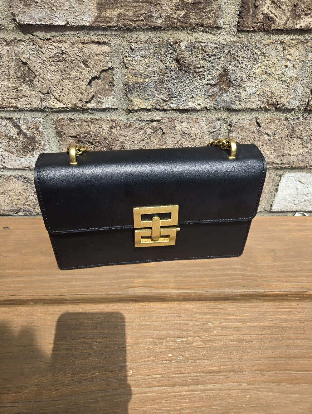 Structured Black Shoulder Bag with Gold Hardware